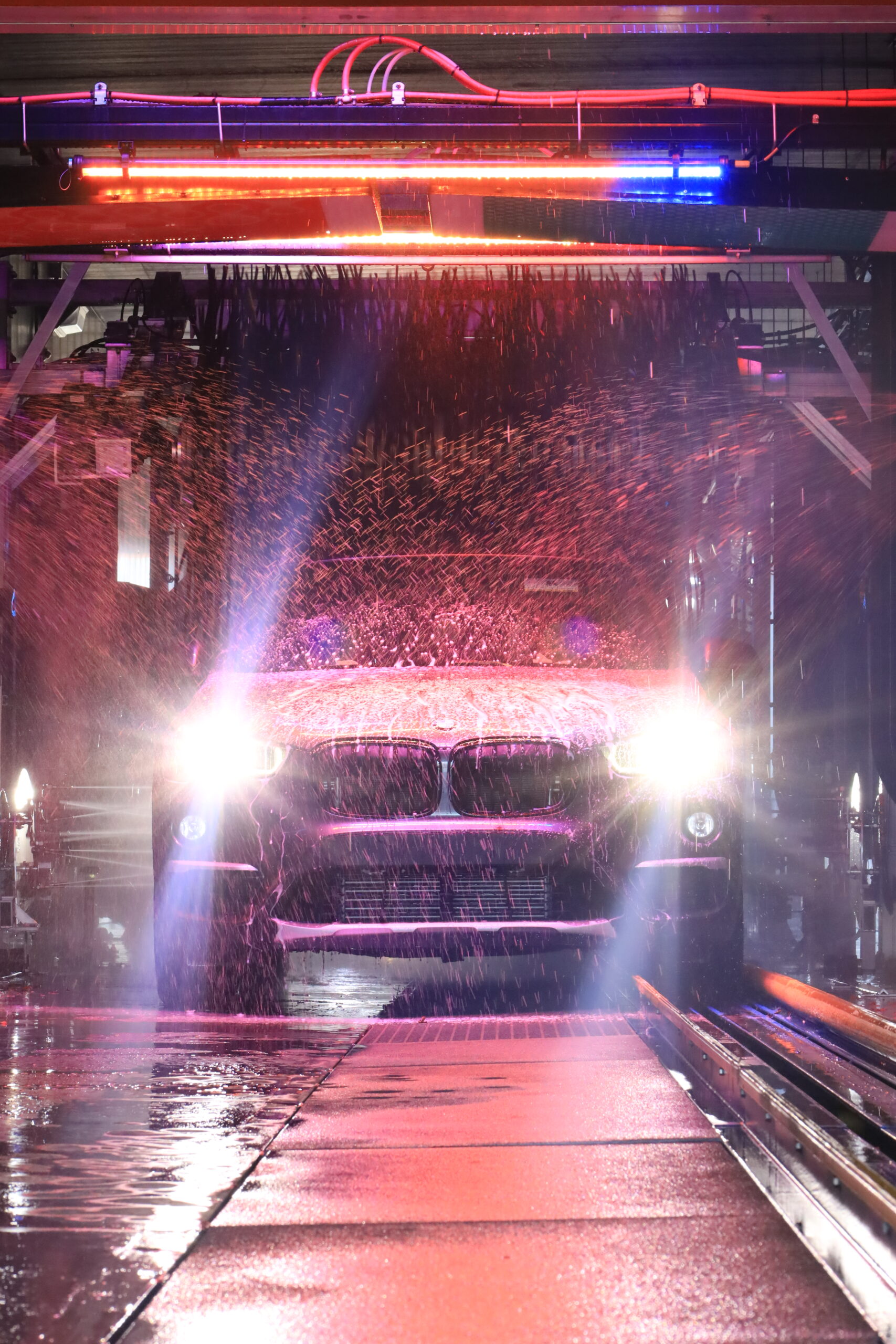 a car having a regular car wash through express car wash tunnels